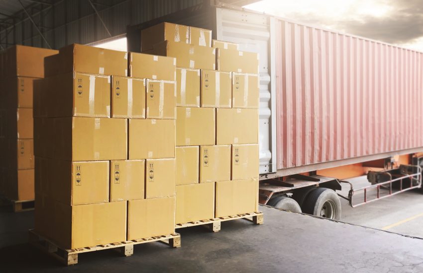 Boxes Unloaded from shipping cargo container awaiting customs clearance