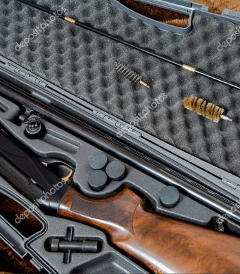 a disassembled 12 gauge hunting shotgun and cleaning kit in a gray gun case Firearms & Parts learn more >