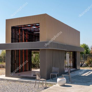Newly built metal framed building with siding. Construction of a new tiny house. selective focus Modular Homes learn more >