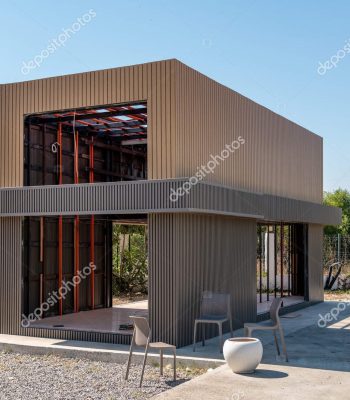 Newly built metal framed building with siding. Construction of a new tiny house. selective focus Modular Homes learn more >